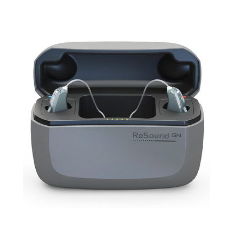 hearing aids charging inside a small grey charger box with modern design