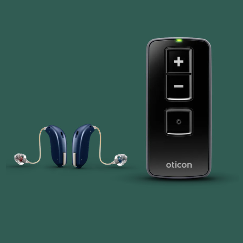 two dark blue hearing aids next to the black oticon remote controller